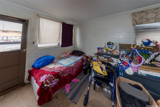 bedroom with concrete block wall