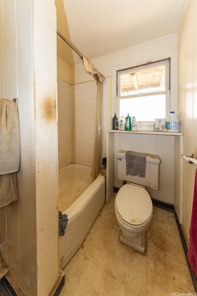 full bathroom featuring tile patterned floors and toilet
