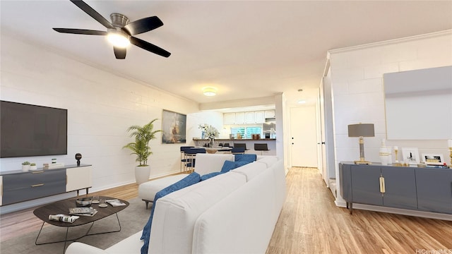 92-755 Makakilo Dr Unit 48, Kapolei, HI 96707 - living area with light wood finished floors, ceiling fan, and ornamental molding