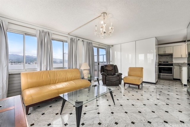2421 Ala Wai Blvd Unit Ph1, Honolulu, HI 96815 - living area with a textured ceiling, light floors, and a chandelier