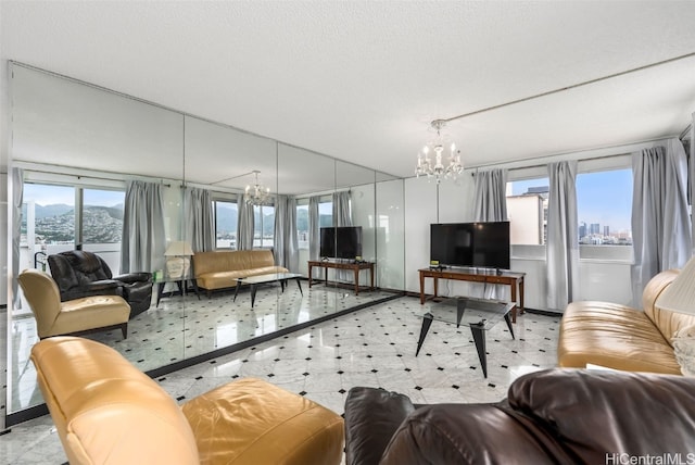 2421 Ala Wai Blvd Unit Ph1, Honolulu, HI 96815 - living room with an inviting chandelier and a textured ceiling