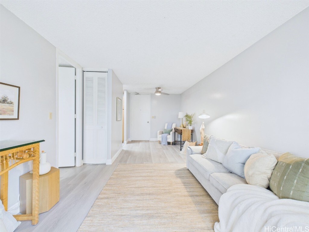 1600 Wilikina Dr Unit C601, Wahiawa, HI 96786 - living room with baseboards, light wood-type flooring, and a ceiling fan