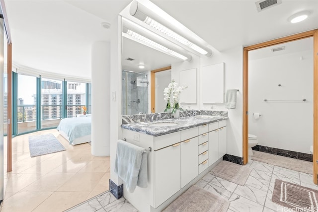 1888 Kalakaua Ave Unit 1705, Honolulu, HI 96815 - ensuite bathroom featuring marble finish floors, a stall shower, double vanity, toilet, and baseboards