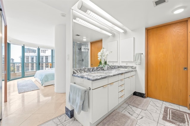 1888 Kalakaua Ave Unit 1705, Honolulu, HI 96815 - ensuite bathroom with marble look tile flooring, a shower stall, and double vanity