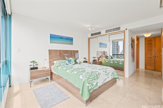 1888 Kalakaua Ave Unit 1705, Honolulu, HI 96815 - bedroom with a closet and light tile patterned floors