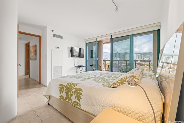 1888 Kalakaua Ave Unit 1002, Honolulu, HI 96815 - bedroom featuring access to outside, tile patterned floors, and rail lighting