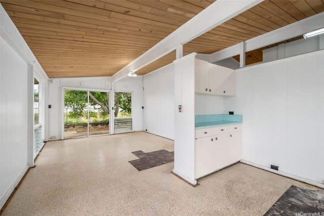 interior space featuring beam ceiling