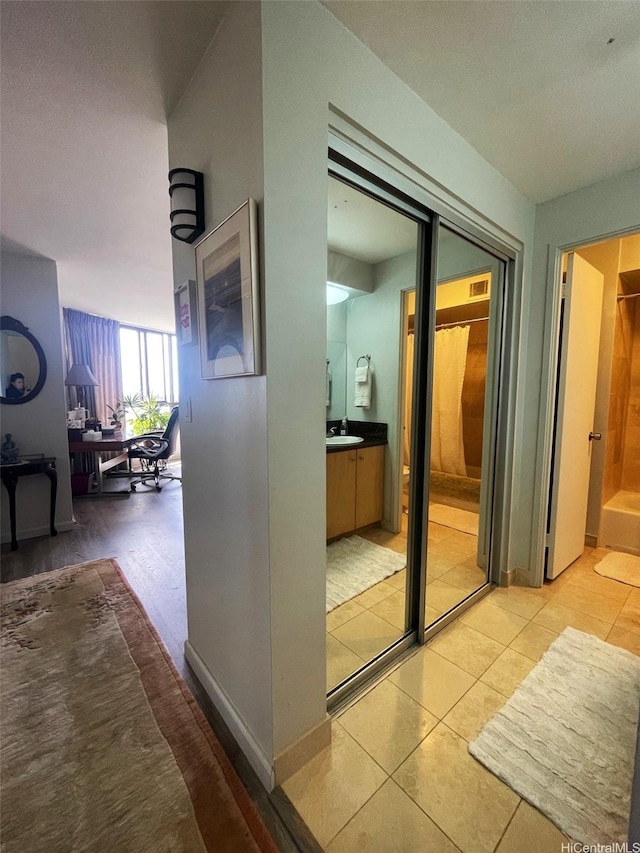 6770 Hawaii Kai Dr Unit 409, Honolulu, HI 96825 - hallway with an office area and light tile patterned flooring