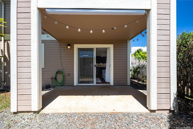 doorway to property with a patio