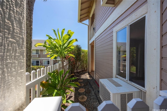 view of side of home with fence