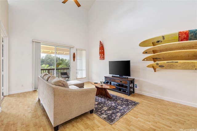 95-996 Wikao St Unit P302, Mililani, HI 96789 - living room with high vaulted ceiling, baseboards, a ceiling fan, and wood finished floors