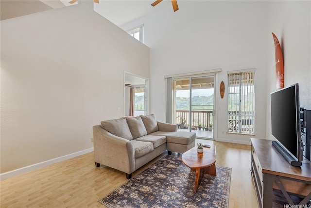 95-996 Wikao St Unit P302, Mililani, HI 96789 - living room featuring baseboards, ceiling fan, wood finished floors, and a high ceiling