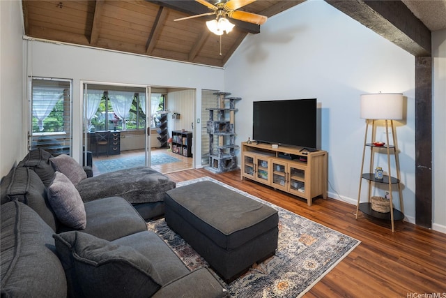 living room featuring baseboards, a ceiling fan, beamed ceiling, and wood finished floors