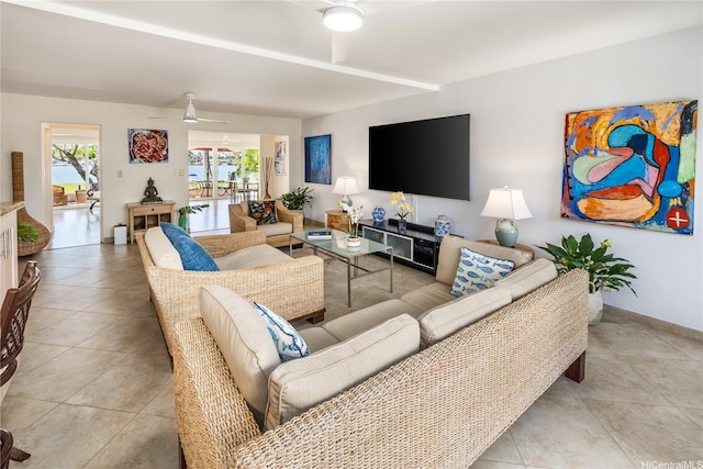 215 Koko Isle Cir Unit 5502, Honolulu, HI 96825 - living room with ceiling fan, light tile patterned floors, and baseboards