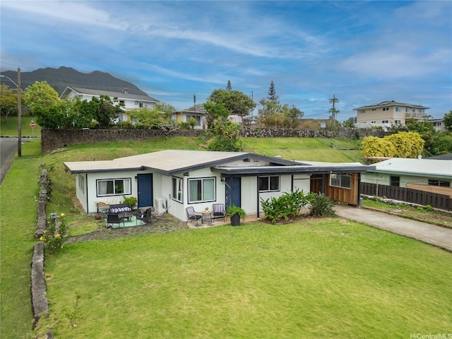 45-563 Kukane St, Kaneohe, HI 96744 - view of front facade featuring concrete driveway and an attached carport