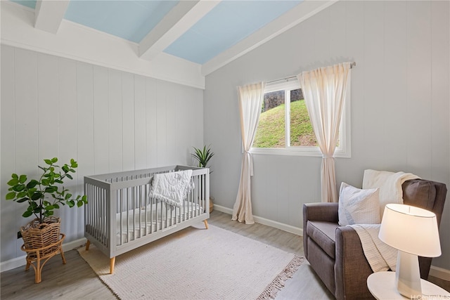 45-563 Kukane St, Kaneohe, HI 96744 - bedroom with wood finished floors, a crib, and baseboards
