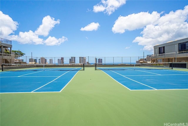 view of sport court featuring fence
