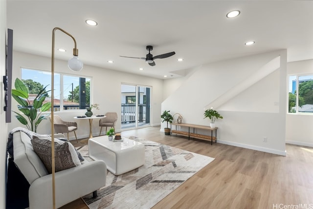 living room featuring baseboards, wood finished floors, recessed lighting, and a ceiling fan