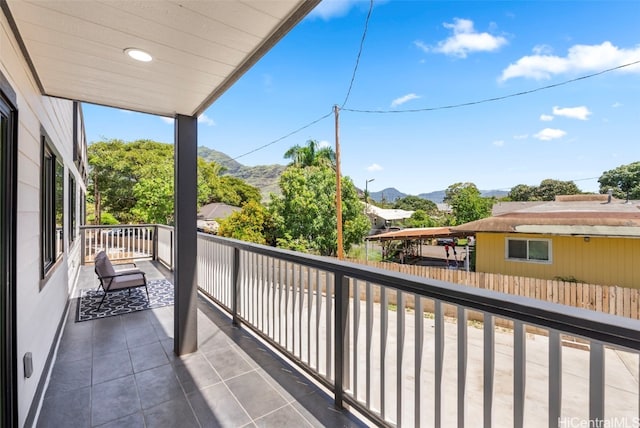 balcony featuring a mountain view