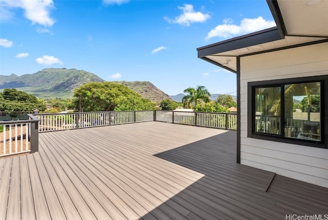 wooden deck with a mountain view