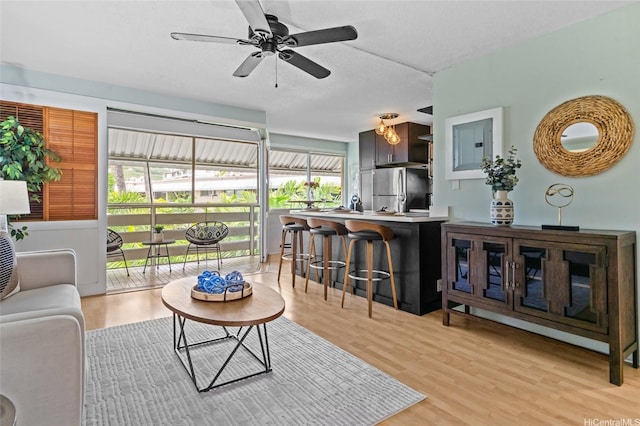 1330 Wilder Ave Unit 310, Honolulu, HI 96822 - living area with ceiling fan and light wood-style flooring