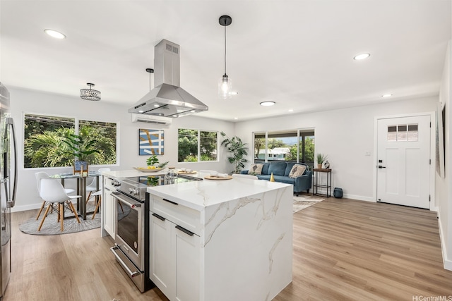 84-1001 Lahaina St Unit 1, Waianae, HI 96792 - kitchen featuring light wood finished floors, appliances with stainless steel finishes, island range hood, and recessed lighting