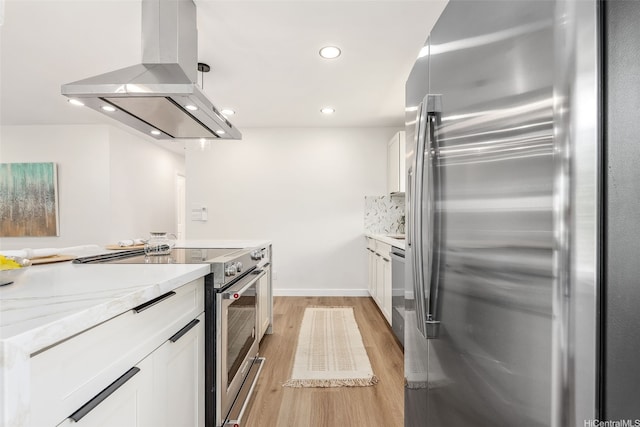 84-1001 Lahaina St Unit 1, Waianae, HI 96792 - kitchen featuring light wood-style flooring, white cabinets, recessed lighting, stainless steel appliances, and island range hood
