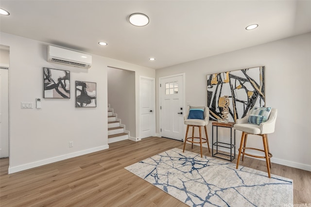 84-1001 Lahaina St Unit 1, Waianae, HI 96792 - entryway with baseboards, an AC wall unit, recessed lighting, wood finished floors, and stairs
