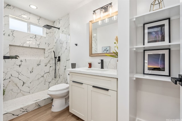 84-1001 Lahaina St Unit 1, Waianae, HI 96792 - full bathroom with a marble finish shower, toilet, vanity, and wood finished floors