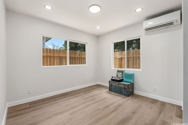 84-1001 Lahaina St Unit 1, Waianae, HI 96792 - spare room with recessed lighting, a wall mounted AC, and wood finished floors
