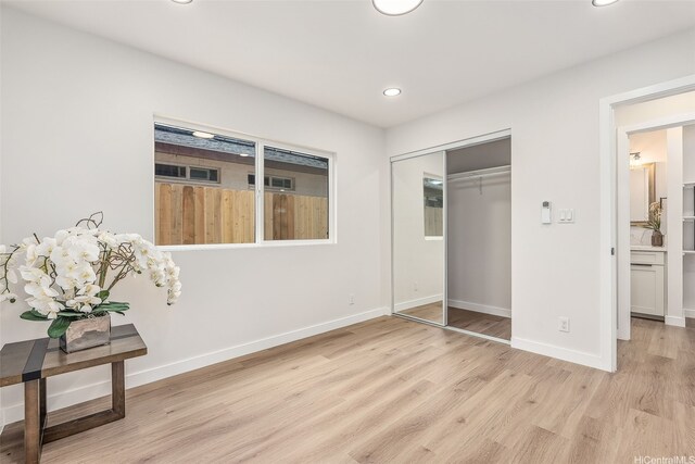 84-1001 Lahaina St Unit 1, Waianae, HI 96792 - unfurnished bedroom featuring a closet, recessed lighting, light wood finished floors, and baseboards