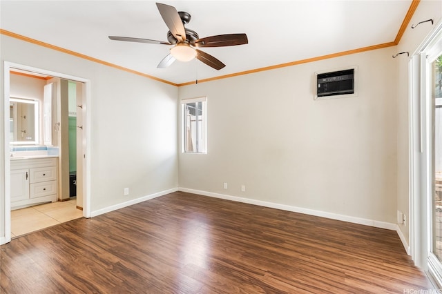 91-1026B Hoomaka St Unit 35, Ewa Beach, HI 96706 - unfurnished bedroom with an AC wall unit, wood finished floors, multiple windows, baseboards, and ornamental molding