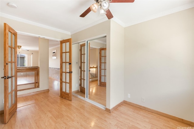 91-1026B Hoomaka St Unit 35, Ewa Beach, HI 96706 - empty room with french doors, ceiling fan, light wood-style flooring, crown molding, and a smoke detector