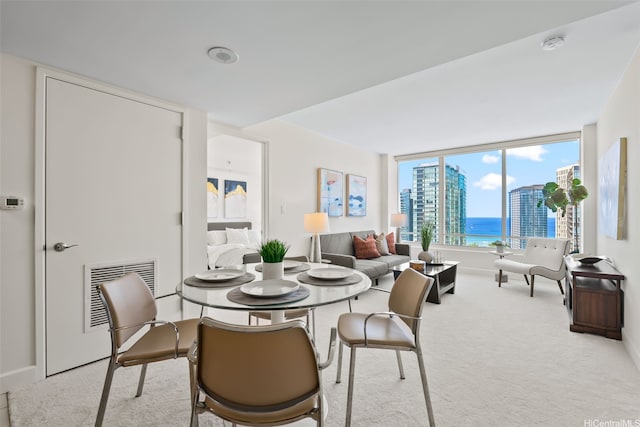 1009 Kapiolani Blvd Unit 3708, Honolulu, HI 96814 - dining area with carpet flooring and a water view