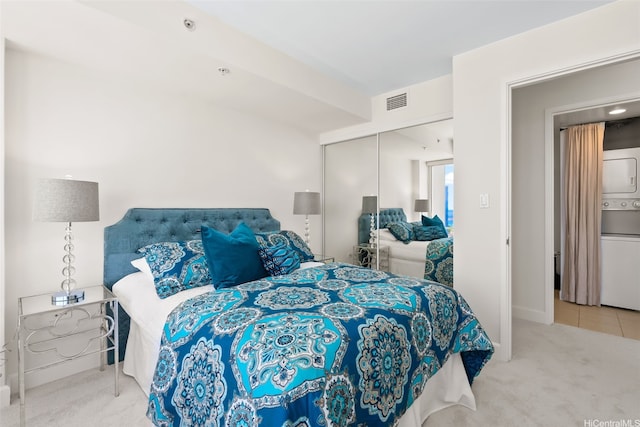 1009 Kapiolani Blvd Unit 3708, Honolulu, HI 96814 - carpeted bedroom featuring stacked washer and clothes dryer and a closet