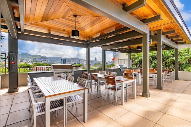 1009 Kapiolani Blvd Unit 3708, Honolulu, HI 96814 - view of patio / terrace with a gazebo, area for grilling, outdoor dining area, a ceiling fan, and a mountain view