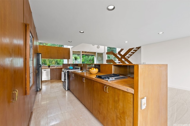156 Forest Ridge Way, Honolulu, HI 96822 - kitchen with appliances with stainless steel finishes, recessed lighting, brown cabinets, and modern cabinets
