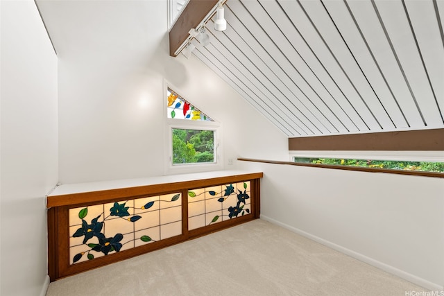 156 Forest Ridge Way, Honolulu, HI 96822 - staircase featuring rail lighting, vaulted ceiling, and carpet