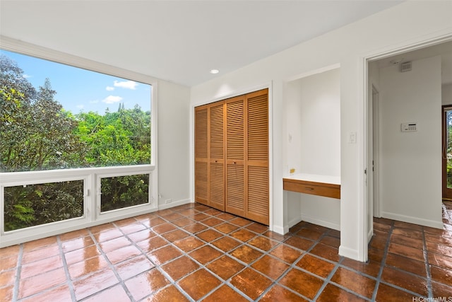 156 Forest Ridge Way, Honolulu, HI 96822 - unfurnished bedroom with a closet, multiple windows, and recessed lighting
