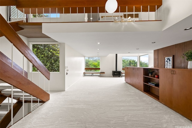 156 Forest Ridge Way, Honolulu, HI 96822 - hallway featuring stairs, carpet, a towering ceiling, and recessed lighting