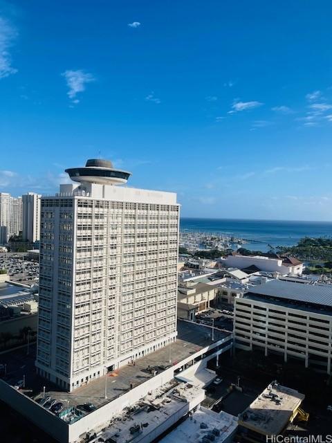 exterior space with a view of city and a water view
