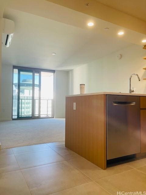 kitchen with light tile patterned flooring, a wall mounted air conditioner, light carpet, dishwasher, and open floor plan