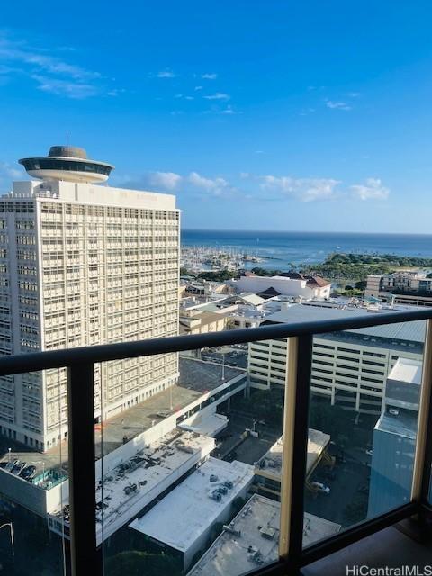 balcony featuring a water view and a view of city