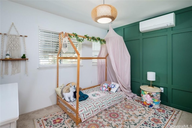 bedroom featuring a decorative wall, a wall mounted AC, carpet floors, and multiple windows