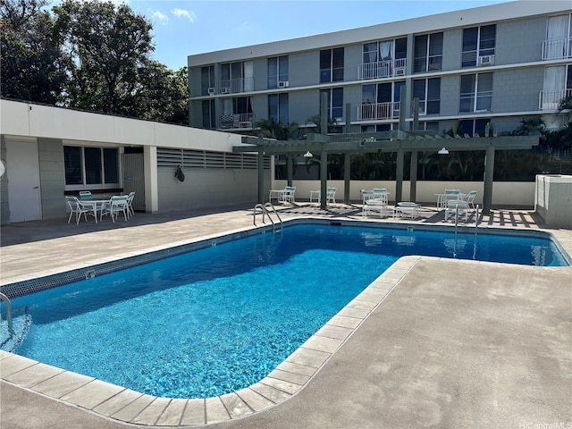 2847 Waialae Ave Unit 209, Honolulu, HI 96826 - community pool featuring a patio and a pergola