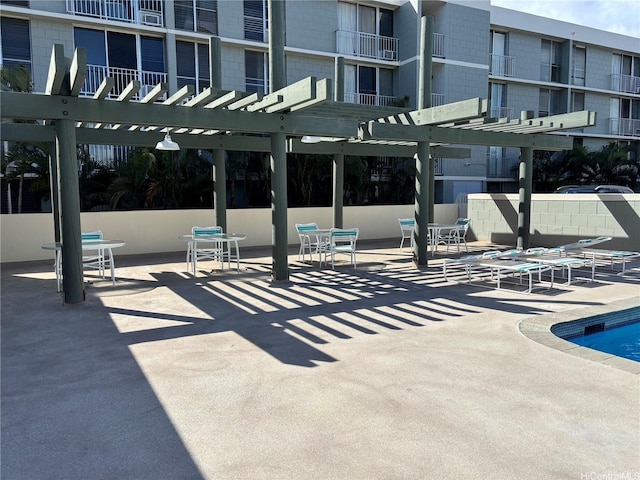 2847 Waialae Ave Unit 209, Honolulu, HI 96826 - view of patio / terrace featuring a pergola and a community pool