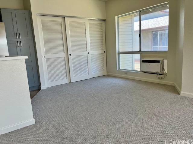 91-495 Puamaeole St Unit 38R, Ewa Beach, HI 96706 - unfurnished bedroom featuring cooling unit, carpet, a closet, and baseboards