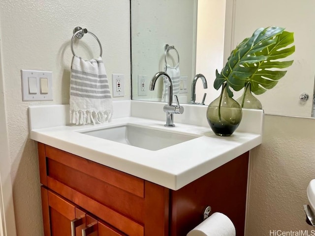 91-495 Puamaeole St Unit 38R, Ewa Beach, HI 96706 - interior details with vanity and a textured wall