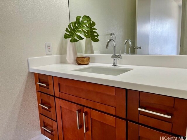91-495 Puamaeole St Unit 38R, Ewa Beach, HI 96706 - bathroom featuring vanity and a textured wall