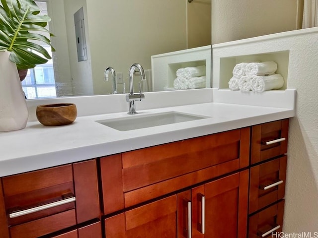91-495 Puamaeole St Unit 38R, Ewa Beach, HI 96706 - bathroom featuring a textured wall and vanity